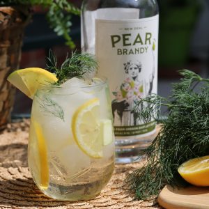 white wine and pear brandy sangria with dill, apple, and lemon