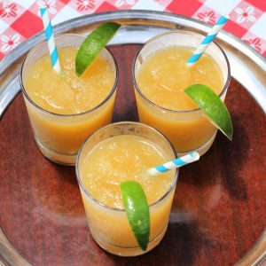 brandy slush with lime wedges