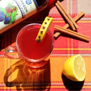 Brambleberry Bourbon Hot Toddy with a clove studded lemon
