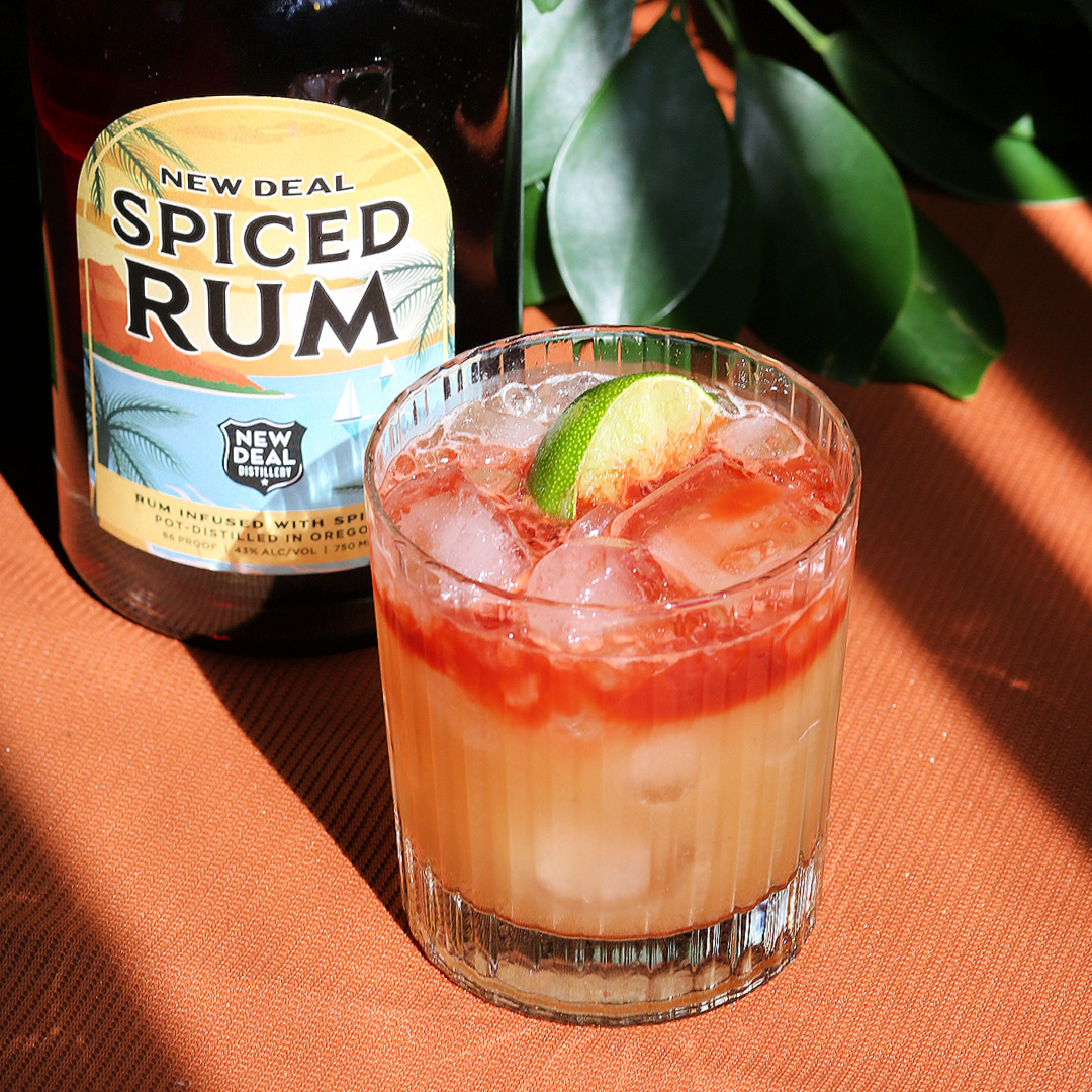 tropical spiced rum cocktail with a float of angostura bitters